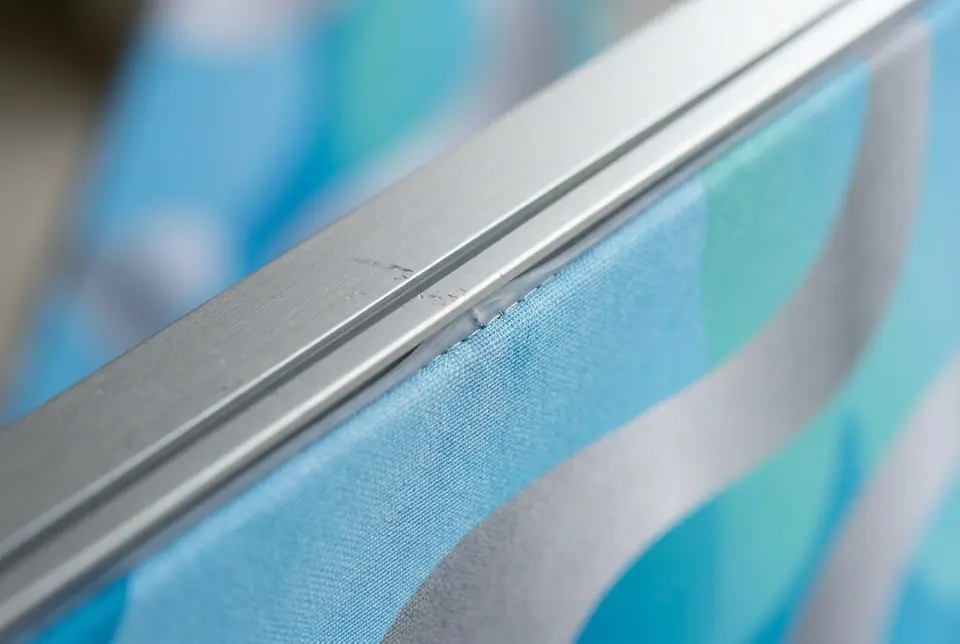 Close-up detail of custom fabric light wall display stand, Colorfly Studio Dubai