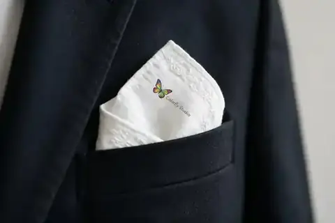 Custom printed pocket handkerchief or square with logo, made at Colorfly Studio in Dubai