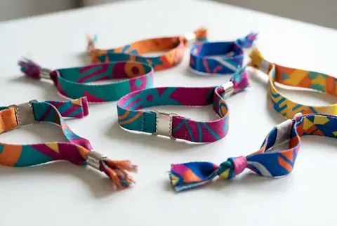 Custom printed fabric wristbands for events in Dubai - Colorfly Studio