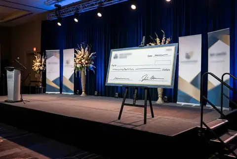 Giant presentation cheque board printed in Dubai - Colorfly Studio